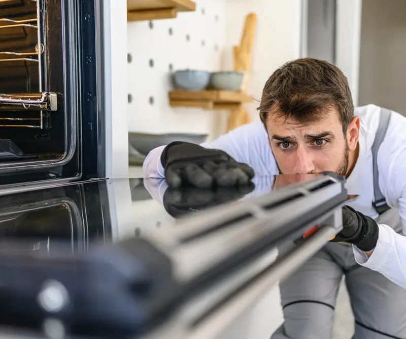 Technician repairing emergency oven repair Toronto same day
