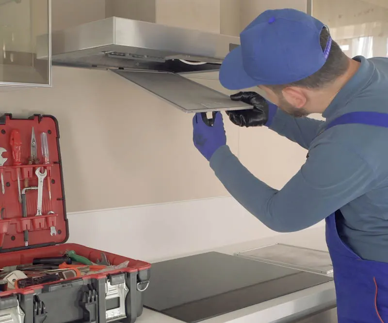 Technician repairing emergency range hood repair Toronto same day